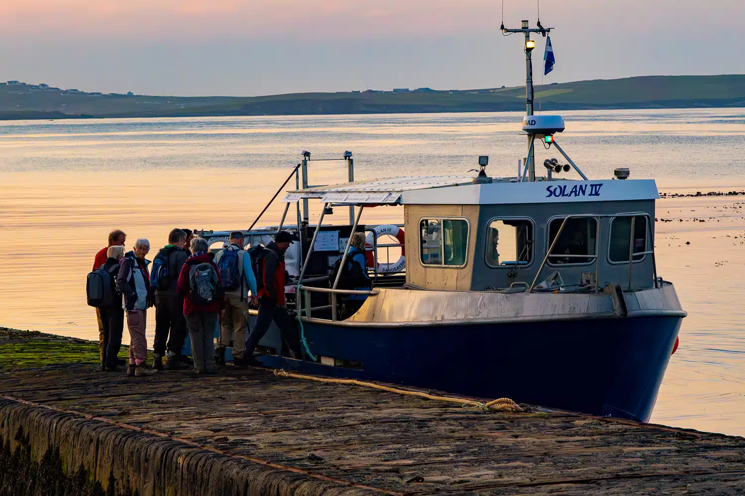 People boarding the "Solan IV" boat in Shetland, for Mousa wildlife visit