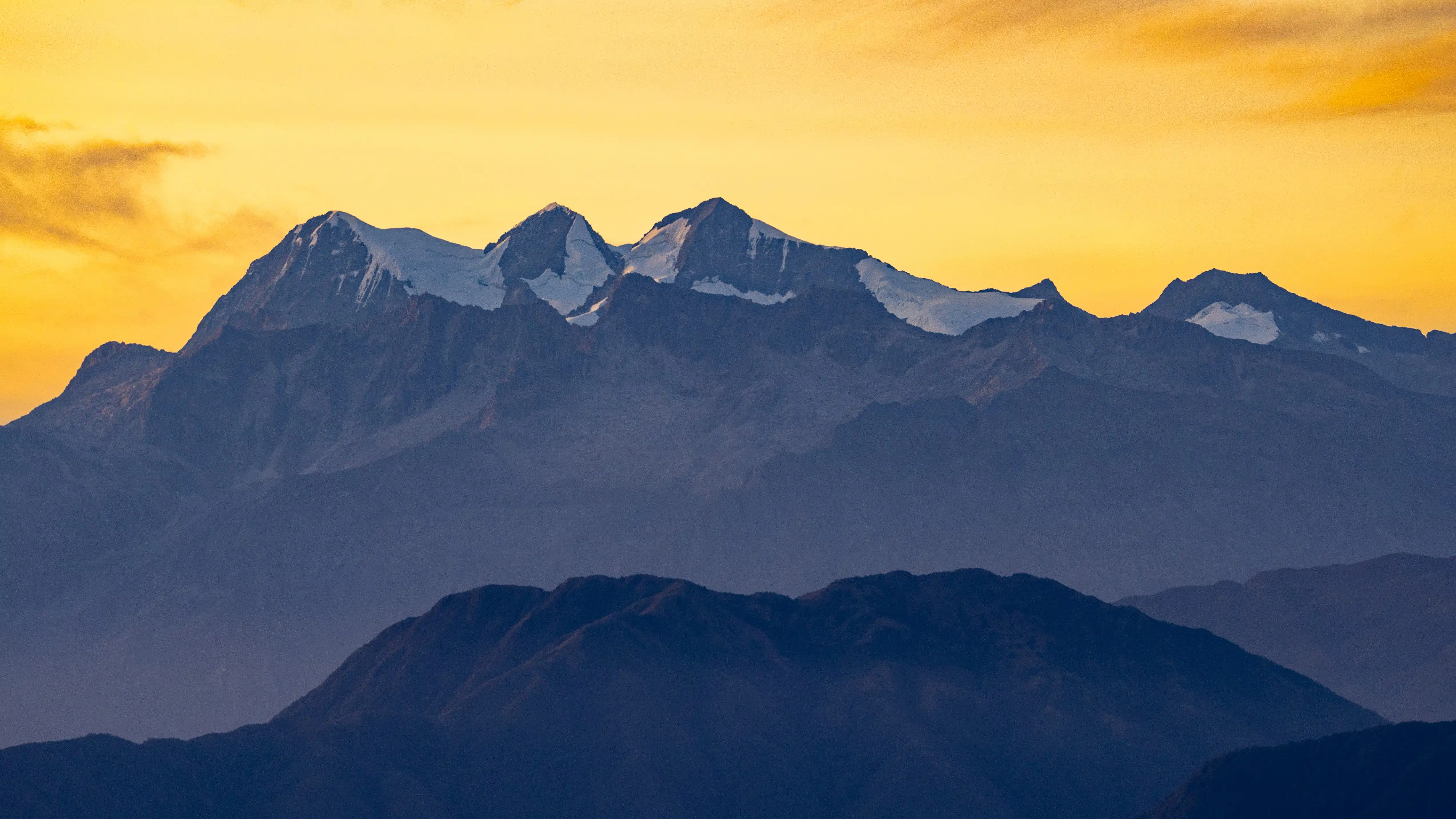 Snow-capped peaks of the Santa Marta Mountains at sunset.