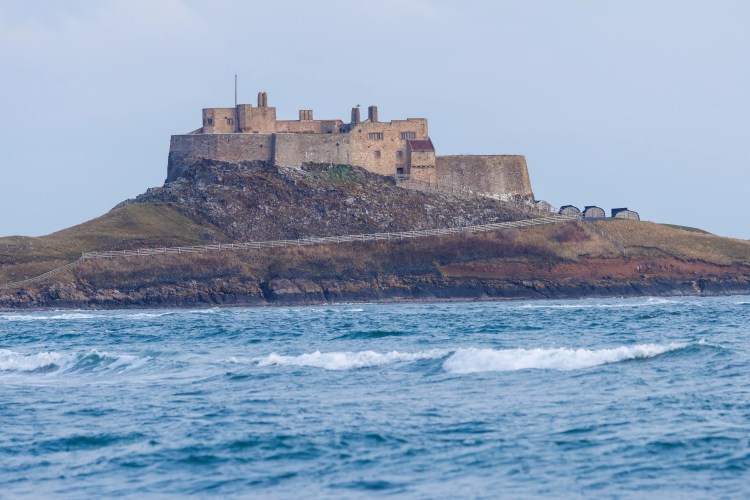 Lindisfarne Castle on Holy Island, Northumbria, viewed from the sea.